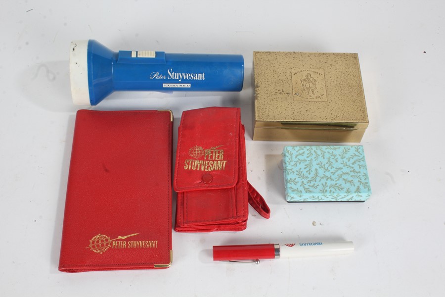 Boxed Peter Stuyvesant flask along with Peter Stuyvesant wallets, torch, and a cigarette box (qty)