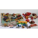 Collection of Britains and Dinky farming related vehicles, plastic moulded farmyard, wooden farm