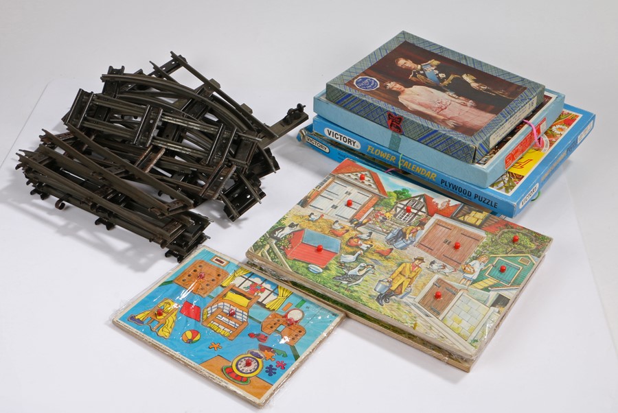 Collection of toys and puzzles, to include tin plate trainset buildings and track, Victory puzzles