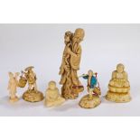 Collection of four Chinese resin figures, one in the form of an immortal with staff, and two