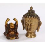 Indian brass buddha's head, 10cm high, and a small bronzed buddha modelled in a seated position, 6cm