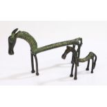 Two bronze horses, after the antiquites, both modelled in a standing position, the longest 22cm (2)