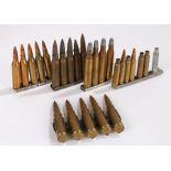 Clips of rounds, various calibres, together with a short belt of 5 linked machine gun rounds, inert,