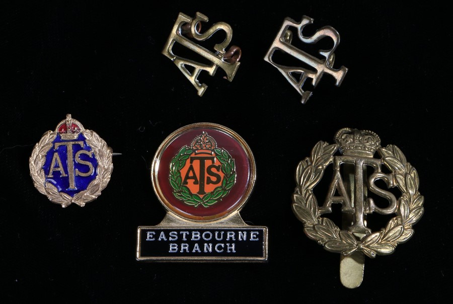 Auxiliary Territorial Service grouping consisting of Cap badge, shoulder titles, two sweetheart