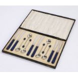 Set of six Art Deco style electro-plated coffee spoons and tea knives, the spoons with blue coffee