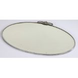 1960's chrome framed mirror, of oval shape, mounted with scrolls, bevelled plate glass mirror,