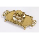 Art Nouveau Geschutzt bronze inkstand, with a glass inkwell to the centre, 26cm wide