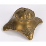 Art Nouveau brass desk inkwell, of square form and having a hinged lid enclosing a green glass