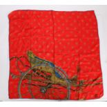 D'Este silk scarf, printed with a carriage on a red ground, signed to bottom right, approx. 75cmx