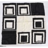 Caruso, silk scarf with black and white squares, signed to bottom right corner, 77cm x 73cm approx.