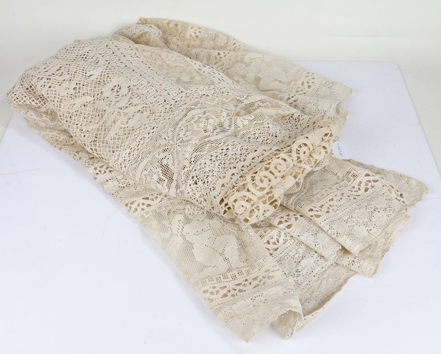 Large lace table cloth, with figural border, approx. 240cm wide x 227cm long