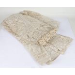 Large lace table cloth, with figural border, approx. 240cm wide x 227cm long