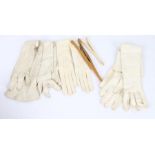Three pair of ladies kid gloves, with a pair of early 20th century ivory glove stretchers and a pair