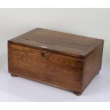 20th Century oak box, with hinged plank lid enclosing a plain interior, raised on four bun feet,