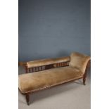 Late Victorian chaise longue, with foliate carving and raised on half fluted legs and castors,