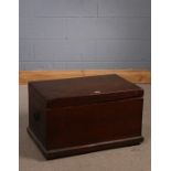 Early 20th Century teak chest, having lift up lid enclosing a plain interior, with carrying handle