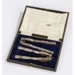 Pair of silver plated nut crackers, with reeded handles, housed in a blue velvet lined case