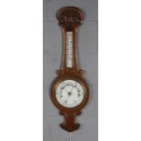 Early 20th Century oak aneroid barometer, with porcelain register and dial, 88cm tall