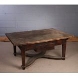 19th Century walnut coffee table, the three planks above the tapering legs and single frieze