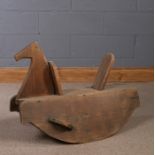 Victorian pine rocking horse, with a shaped head above the arched rocker base, 76cm long, 59cm high