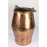 Early 20th Century copper swing handled pot, having shaped rivetted body, 46cm high excluding