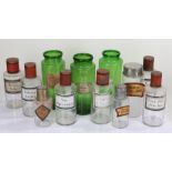 Collection of apothecary jars, in clear glass and green glass with labels, size range, 17.5cm high