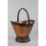 Victorian copper coal scuttle, the tapered shaped body with steeped foot, 46cm high