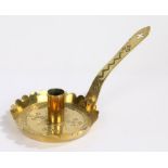 Late 19th/early 20th Century brass chamberstick, the long handle with pierced Gothic style motif,