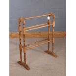 Beech towel rail, with arched ends and five stretchers, 61.5cm wide