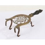 19th Century brass trivet, with a horse shoe shape fret top and turned handle, 32cm long