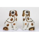 Pair of Staffordshire pottery spaniels, with brown lustre decoration, 27cm high