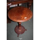 Victorian mahogany wine table, with circular top above a turned column and circular base raised on