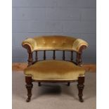 Victorian walnut tub chair, having button down upholstery and spindle back rest, with deep seat