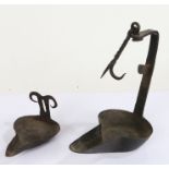 Two 19th Century wrought iron Cruisie lamps, one with hook suspension (2)