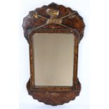 18th Century style walnut wall mirror, having gilt Knights helmet and crossed halberd's motif,