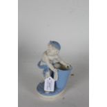 Royal Worcester bisque porcelain figure depicting a young boy with a basket, 20cm high, AF