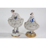 Two Sitzendorf porcelain figures, with of ladies with foliate dresses, crown above S marks to the