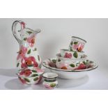 John Buck porcelain wares, decorated with flowers, to include a large jug, wash bowl, further