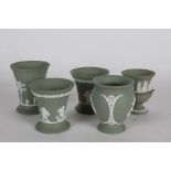 Five Wedgwood green jasperware vases, with classical decoration (5)