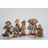 Six early to mid 20th Century Goebbel porcelain figures, to include boy singing, girl with