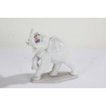 Lladro elephant, with a raised trunk and flowers, 13cm high