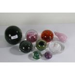 Nine various glass paperweights, to include a Langham pig and Caithness Cauldron (9)