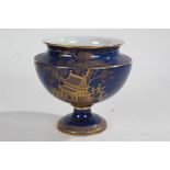 Carlton Ware blue lustre pedestal bowl, with gilt Oriental landscape decoration, 17cm high