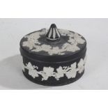 Wedgwood black basalt pot and cover, with white fruiring vine decoration