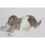 Lladro dog, modelled lying down, 17cm long