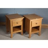 Pair of oak bedside cabinets, the rectangular top above a single drawer, raised on square tapering