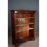 Edwardian mahogany bookcase, the moulded cornice above three adjustable shelves, raised on bracket