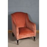 Wing arm chair upholstered in pink fabric, with ebonised feet, 97cm tall