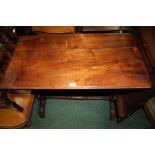 Late Victorian stretcher table, the oblong top raised on turned legs and united by a single