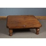 Pine low table, square top above bun feet, 98cm wide